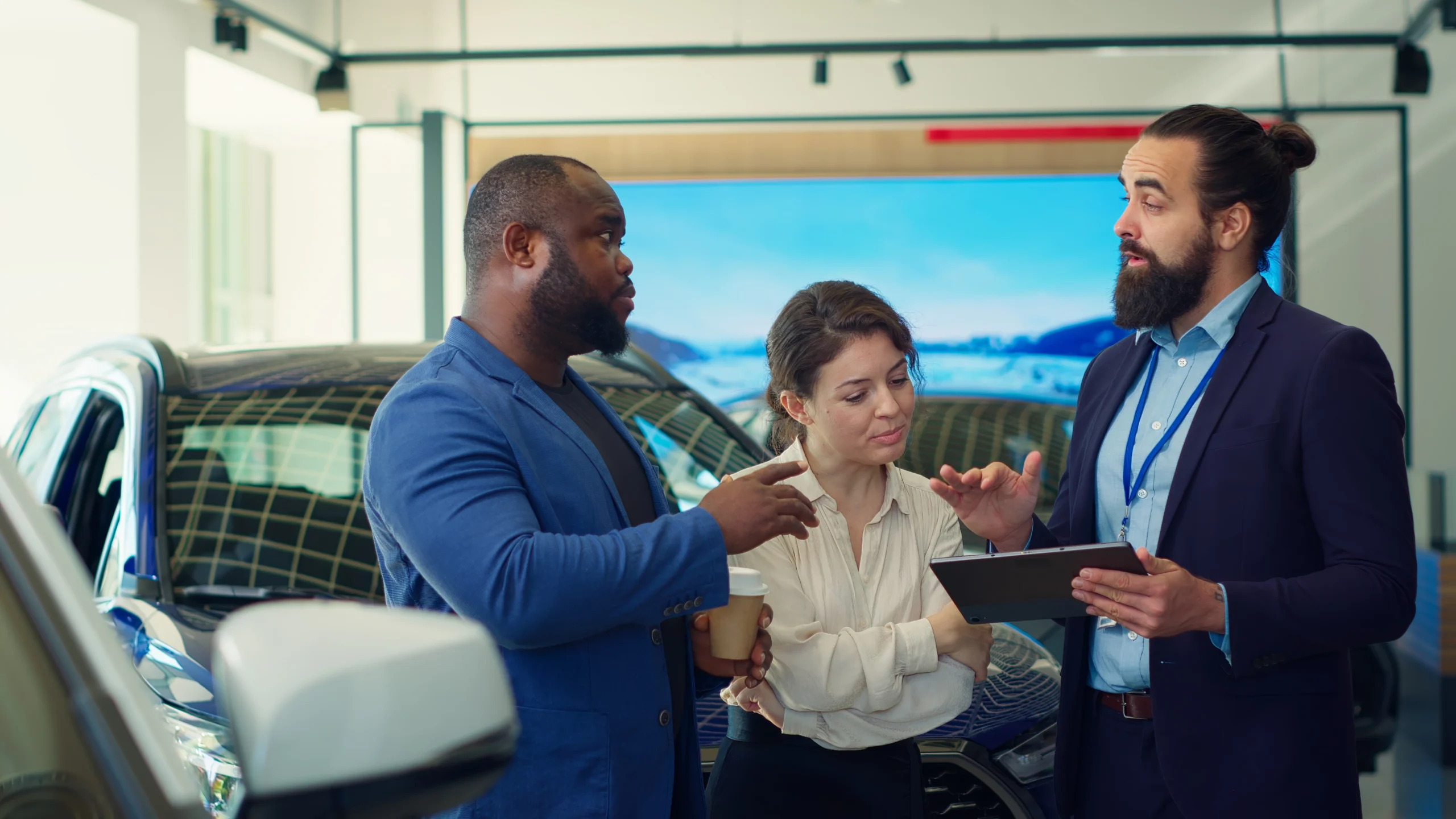 car-dealership-salesman-showing-product-offerings-tablet-clients Mercedes-Benz beVisioneers Fellowship Mentorship Program 2025