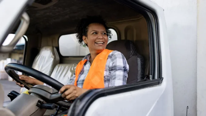 female-truck-driver-smiling-cab-1200x628 Truck Helper